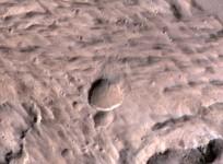 The new Mars crater spans half the length of a football field in this photo from the Mars Reconnaissance Orbiter's sharpest-sighted camera, the High Resolution Imaging Science Experiment.(NASA/JPL-Caltech/University of Arizona)