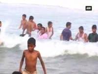 people-visit-beaches-water-parks-to-cool-off-in-summer-heat