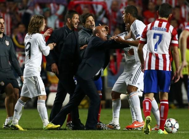 Atletico Madrid's coach Diego Simeone argues with Real Madrid's Varane during their Champions League final in Lisbon Atletico Madrid boss Diego Simeone