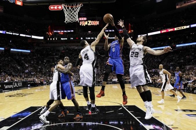 Thunder's Russell Westbrook drives to the basket as the Spurs' Danny Green and Tiago Splitter defend. Russell Westbrook Oklahoma City Thunder