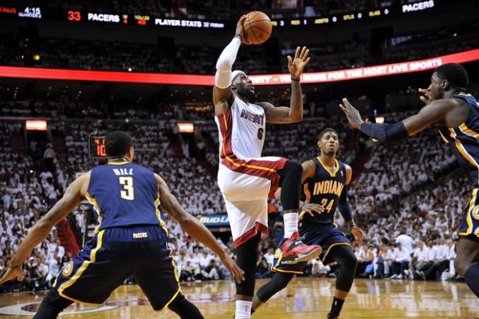 Miami Heat's LeBron James drives to the basket against the Indiana Pacers. LeBron James Miami
