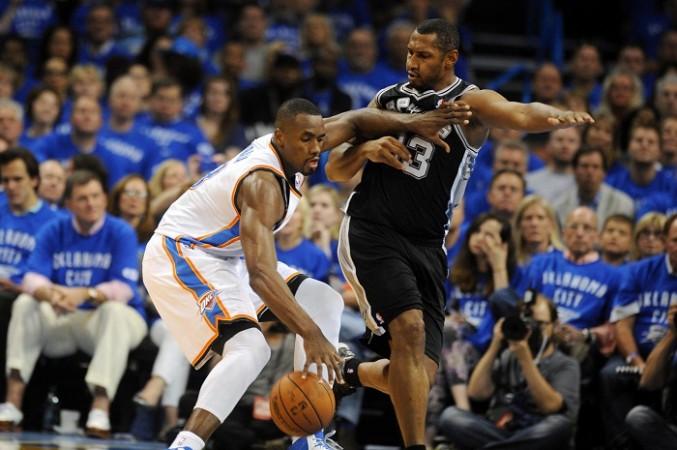 Thunder's Serge Ibaka handles the ball against the Spurs' Boris Diaw. Serge Ibaka