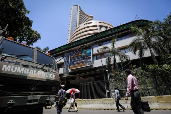 People walk past the BSE building in Mumbai