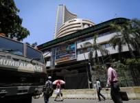 People walk past the BSE building in Mumbai