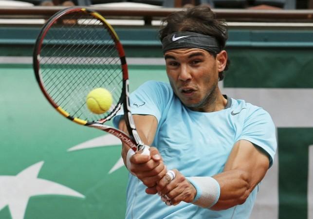 Rafael Nadal hits a return to Dominic Thiem during their match at the French Open. Rafael Nadal French Open