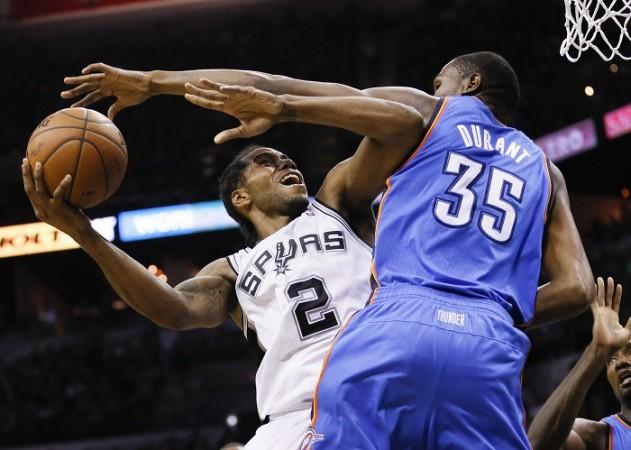 San Antonio's Kawhi Leonard shoots over Oklahoma City's Kevin Durant. Kawhi Leonard
