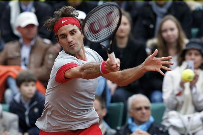 Roger Federer returns a forehand to Diego Sebastian Schwartzman at the French Open, Roger Federer French Open