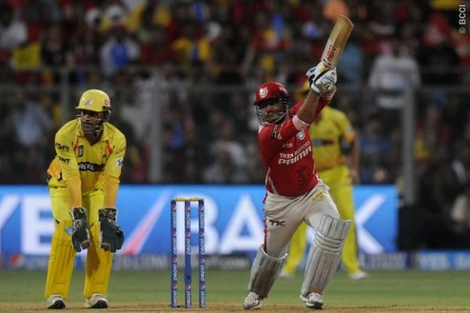 Kings XI Punjab batsman Virender Sehwag admires his shot during the IPL 2014 Qualifier 2 against CSK, 30 May Virender Sehwag Kings XI Punjab MS Dhoni CSK