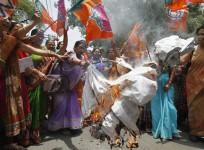 Women workers of India's ruling BJP burn effigy of Yadav, chief minister of Uttar Pradesh, during protest against recent killings of two girls, in Allahabad (2014-05-31)