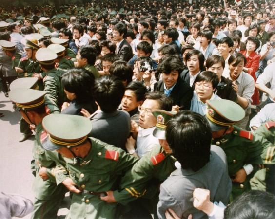 A file photo of crowds of jubilant students surging through a police cordon, before pouring into Tiananmen Square File photo of crowds of jubilant students surging through a police cordon before pouring into Tiananmen Square