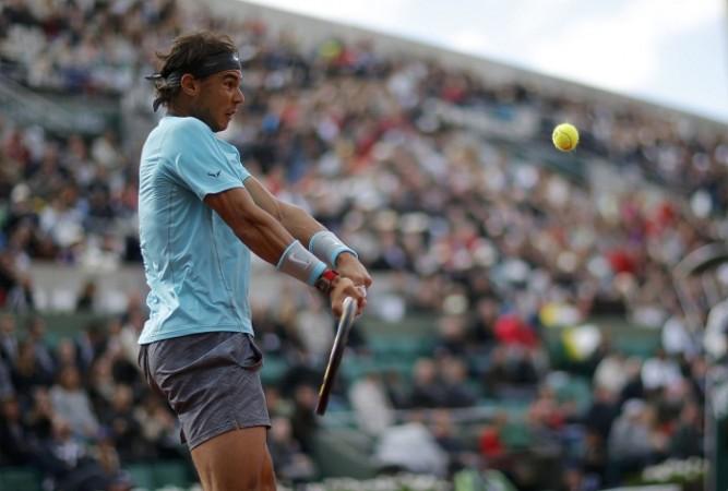 Rafael Nadal fires in a backhand during his match against David Ferrer in the quarterfinals of the French Open, 4 June Rafael Nadal French Open