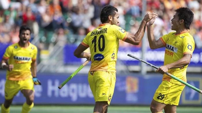 Indian striker Dharamvir Singh celebrates after scoring against England in the World Cup. Dharamvir Singh Hockey