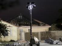 A damaged house is seen at the scene of a U.S. military jet crash in Imperial, California
