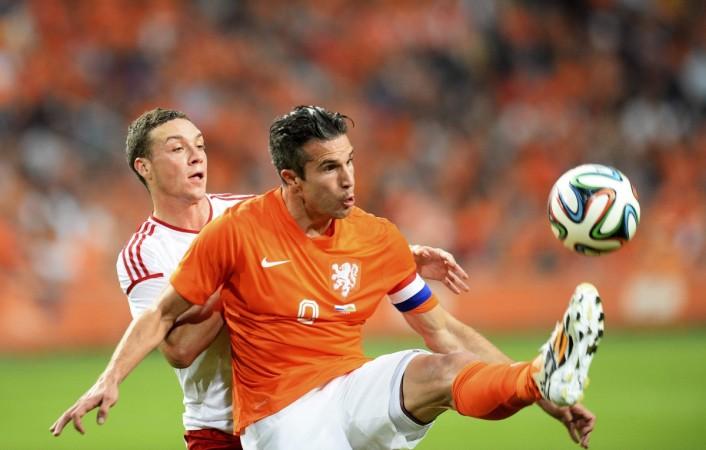 Robin van Persie of the Netherlands fights for the ball with James Chester of Wales during their international friendly in Amsterdam Holland striker Robin van Persie