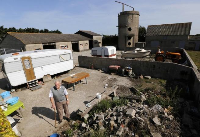 Farmer Bertot poses on his property near the former D-Day landing zone of Utah Beach in Les Dunes de Varreville