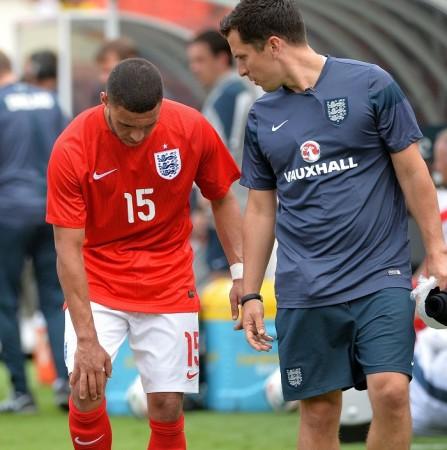 Oxlade-Chamberlain walks off the field after injuring his knee in the pre-World Cup friendly against Ecuador Alex Oxlade-Chamberlain England