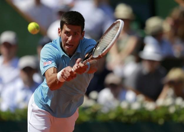 Novak Djokovic essays a backhand during his semifinal against Ernests Gulbis in the French Open semifinals, 6 June Novak Djokovic French Open
