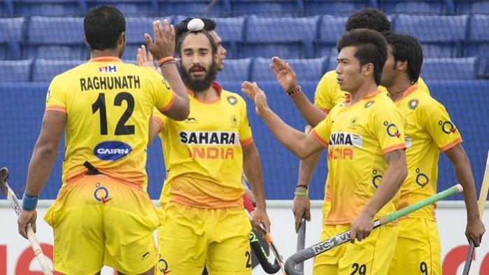 Indian team celebrates after scoring their first goal against Malaysia. Indian Hockey Team