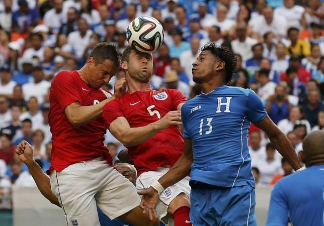 England's Cahill heads the ball away from Honduras' Carlo Costly during their international friendly in Miami England's Cahill heads the ball away from Honduras' Carlo Costly during an international friendly soccer match in Miami