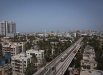 Metro trains pass through a residential area during its first official safety trial run in Mumbai (Reuters, file)