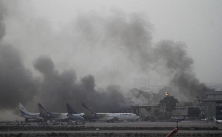Smoke billows from Jinnah International Airport in Karachi Smoke billows from Jinnah International Airport in Karachi