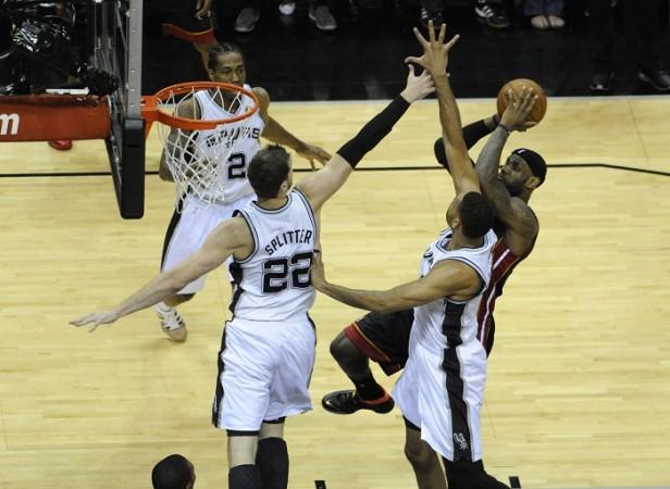 Miami Heat's LeBron James shoots against San Antonio Spurs. LeBron James