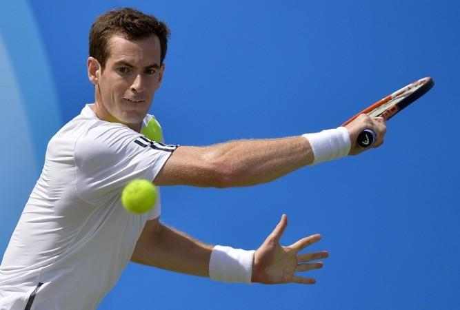 Andy Murray hits a return against Paul-Henri Mathieu at the Queen's Club Championships. Andy Murray Queen Club