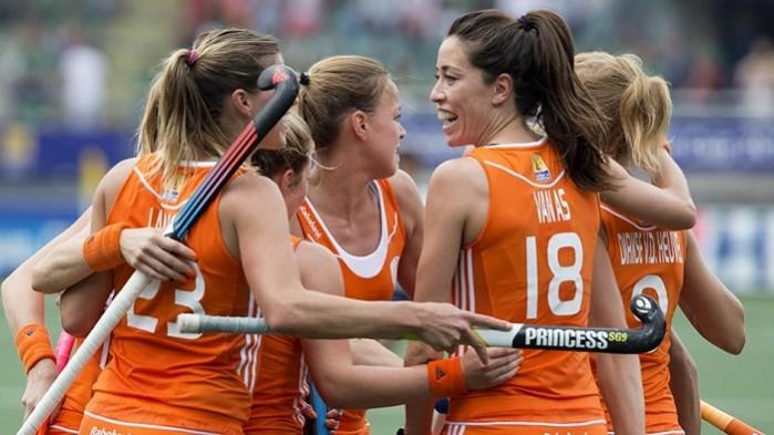 Netherlands team celebrates after scoring against Korea. Netherlands Hockey Team