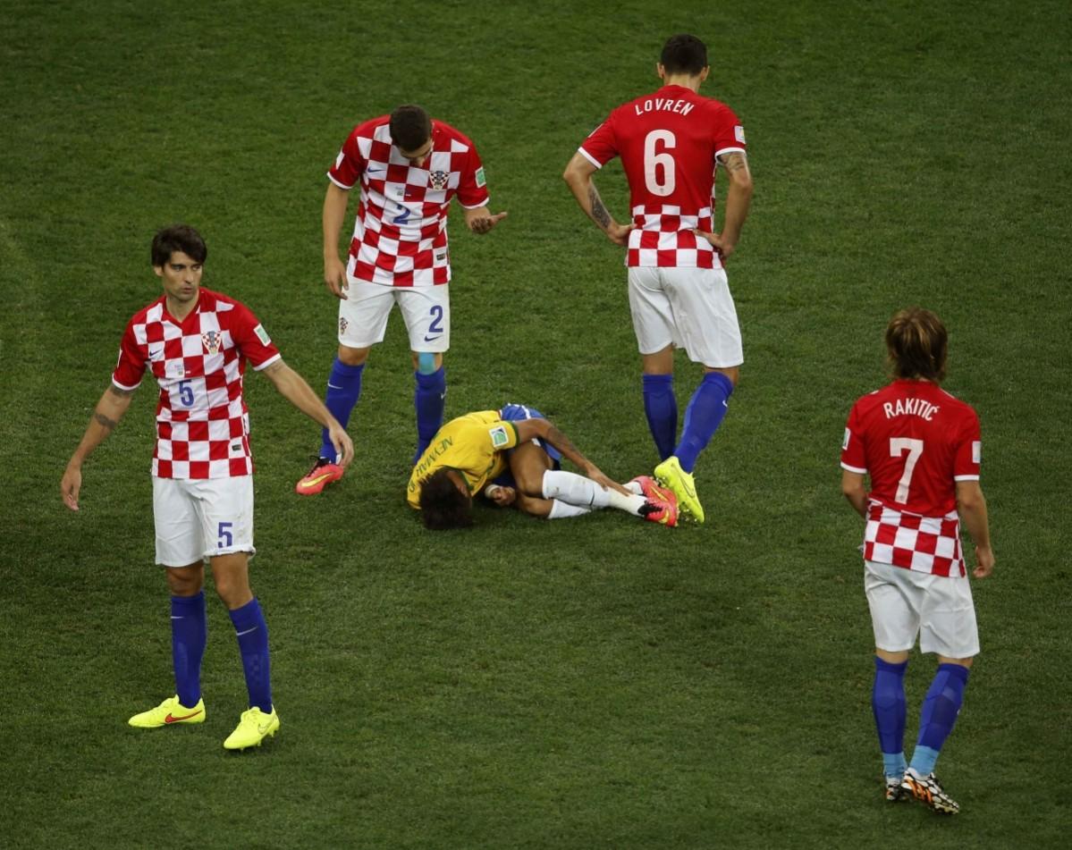 Brazil's Neymar lies on the pitch after being fouled by Croatia's Corluka Brazil v Croatia