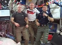 (From left) Expedition 40 Commander Steve Swanson and Flight Engineers Alexander Gerst and Reid Wiseman wish soccer fans and the World Cup 2014