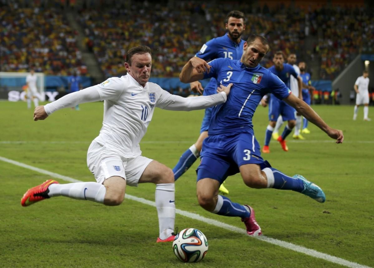 England's Wayne Rooney and Italy's Giorgio Chiellini fight for the ball Italy v England