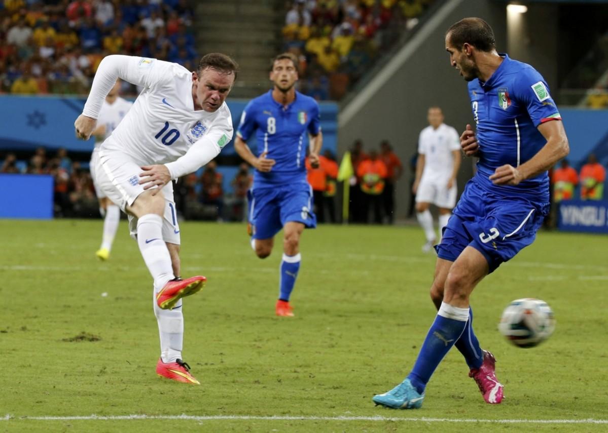 England's Wayne Rooney takes a shot at goal Italy v England