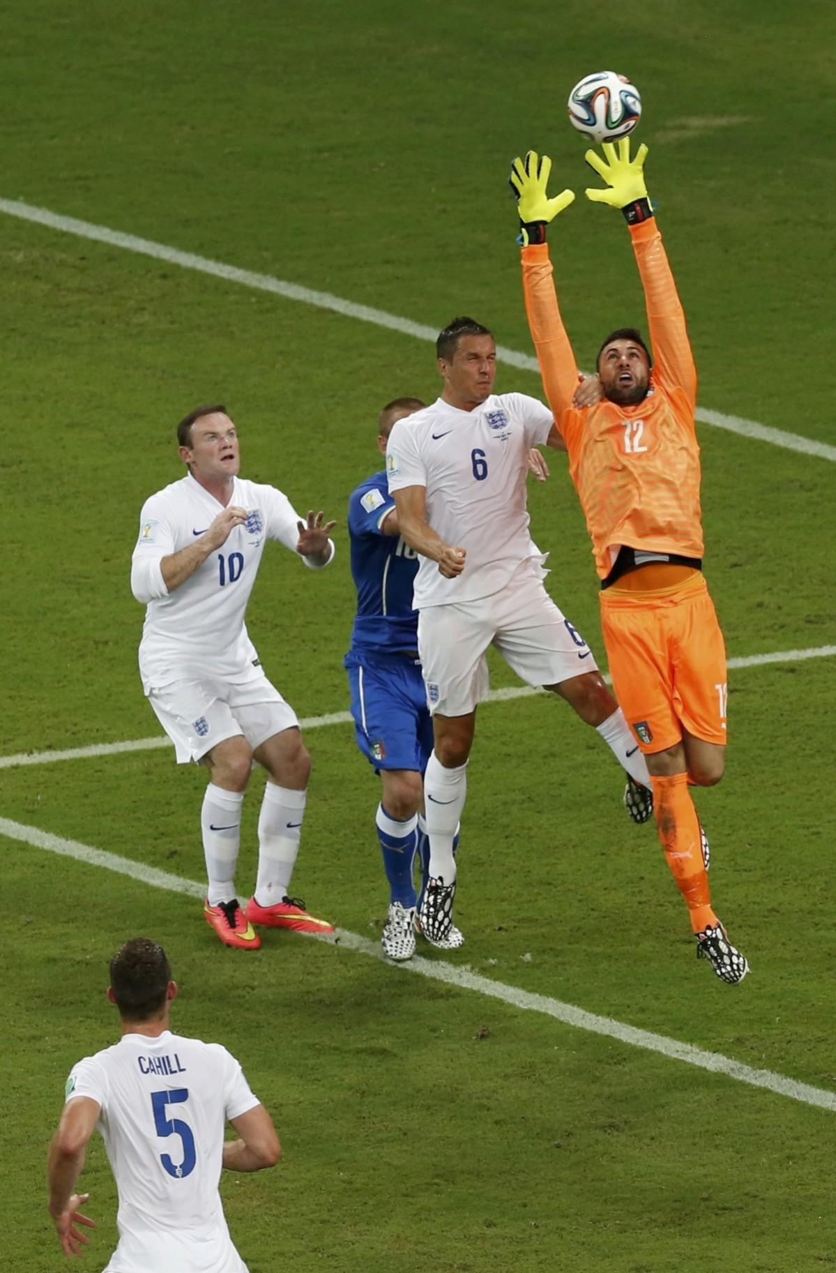Italy's goalkeeper Sirigu saves the ball during the 2014 World Cup Group D soccer match against England Italy v England