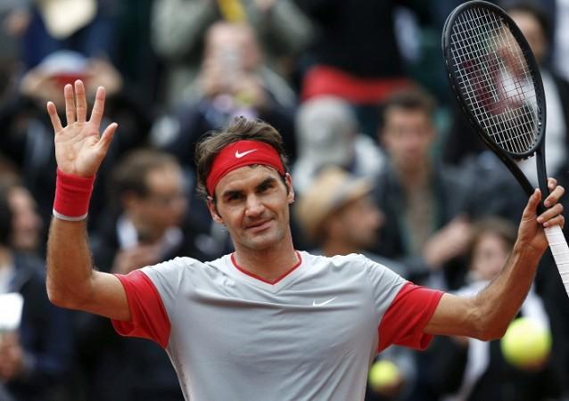Roger Federer acknowledges crowd during French Open. Roger Federer