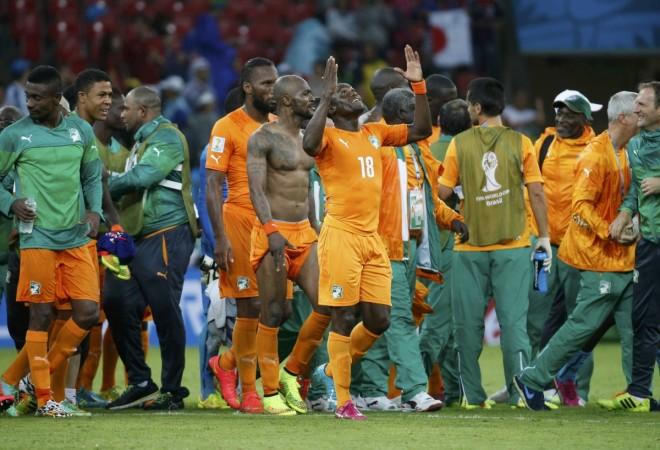 Ivory Coast's players celebrate after their 2014 World Cup Group C soccer match against Japan at the Pernambuco arena in Recife Ivory Coast v Japan