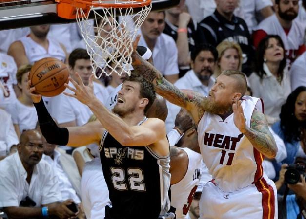 Tiago Splitter goes up for a shot past the Miami Heat's Chris Andersen in NBA Finals. Tiago Splitter