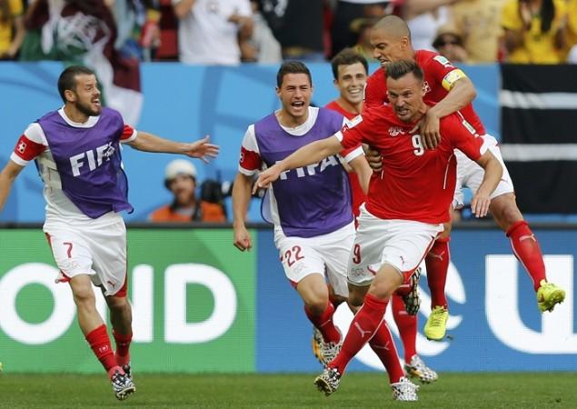 Switzerland striker Haris Seferovic celebrates with his teammates after scoring the winner against Ecuador, 15 June Haris Seferovic Switzerland