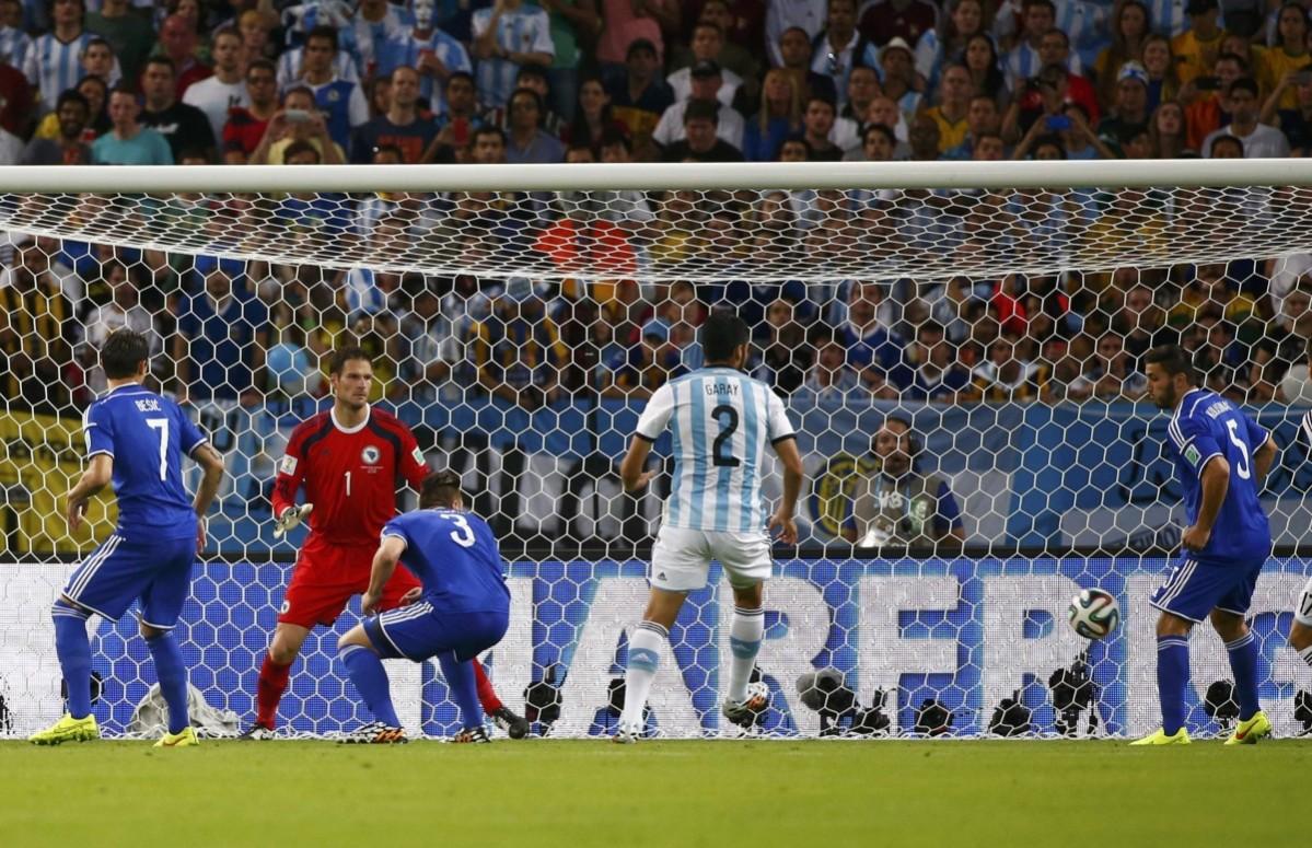 The ball hits Bosnia's Sead Kolasinac for an own goal during the 2014 World Cup Group F soccer match against Argentina Argentina vs Bosnia and Herzegovina