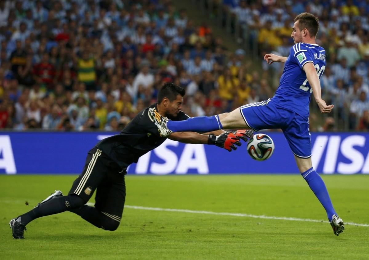 Argentina's Sergio Romero saves a shot from Bosnia's Izet Hajrovic during the 2014 World Cup Group F soccer match at the Maracana stadium in Rio de Janeiro Argentina vs Bosnia and Herzegovina
