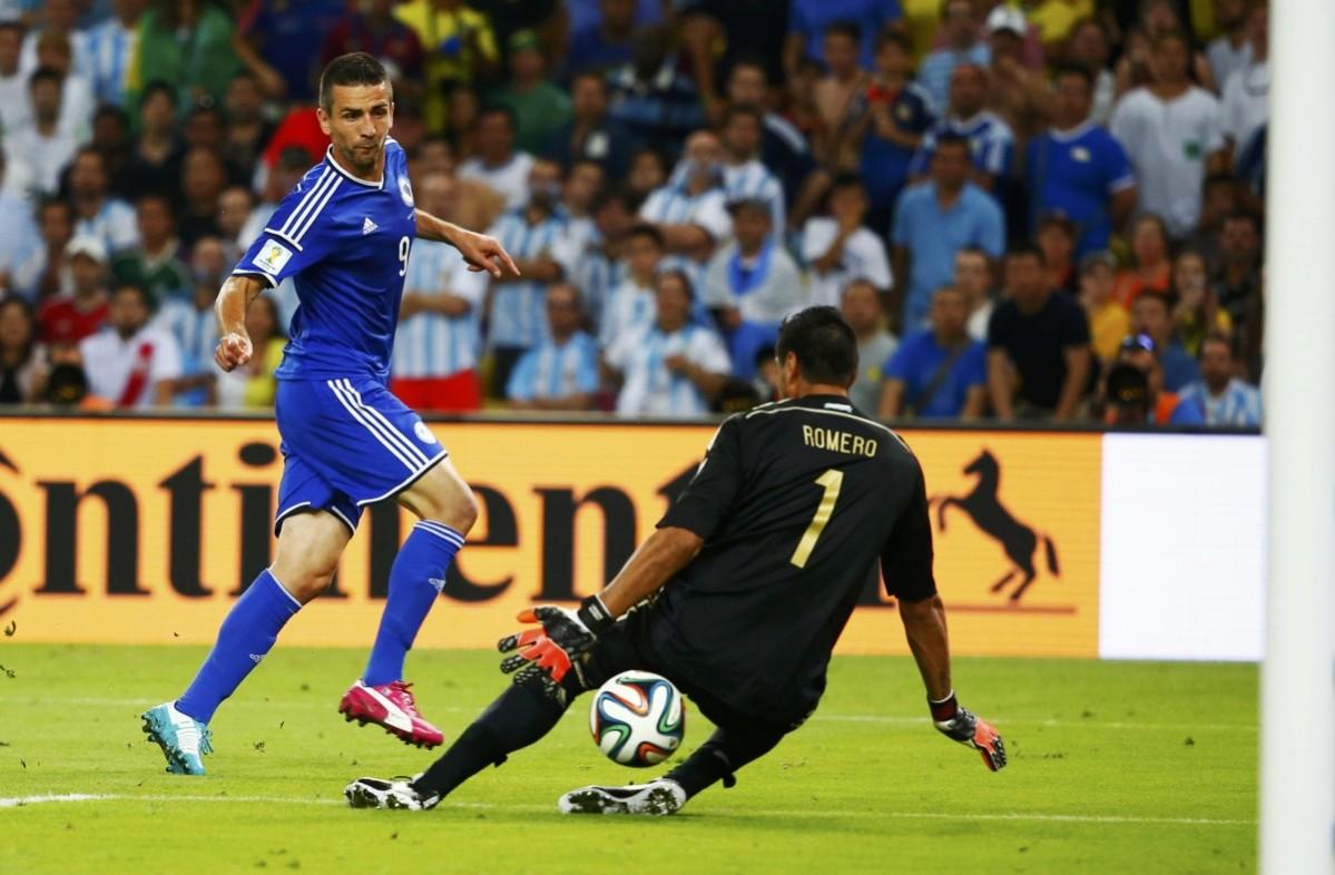 Bosnia's Ibisevic scores through the legs of Argentina's Romero during their 2014 World Cup Group F soccer match at the Maracana stadium in Rio de Janeiro Argentina vs Bosnia and Herzegovina