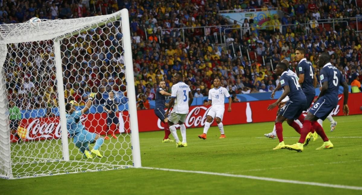 France's Karim Benzema scores his side's third goal during World Cup Group E soccer match at the Beira Rio stadium France v Honduras