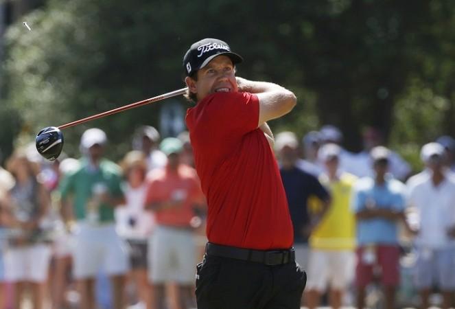 Erik Compton watches his tee shot during the final round of the US Open Championship. Erik Compton