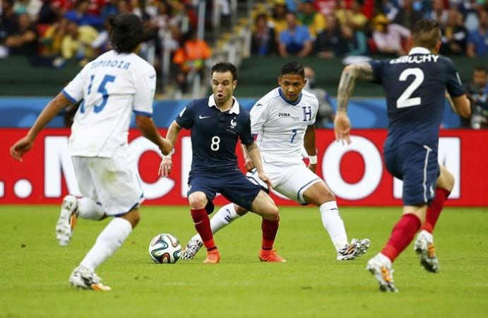 Mathieu Valbuena controls the ball next to Emilio Izaguirre. Mathieu Valbuena