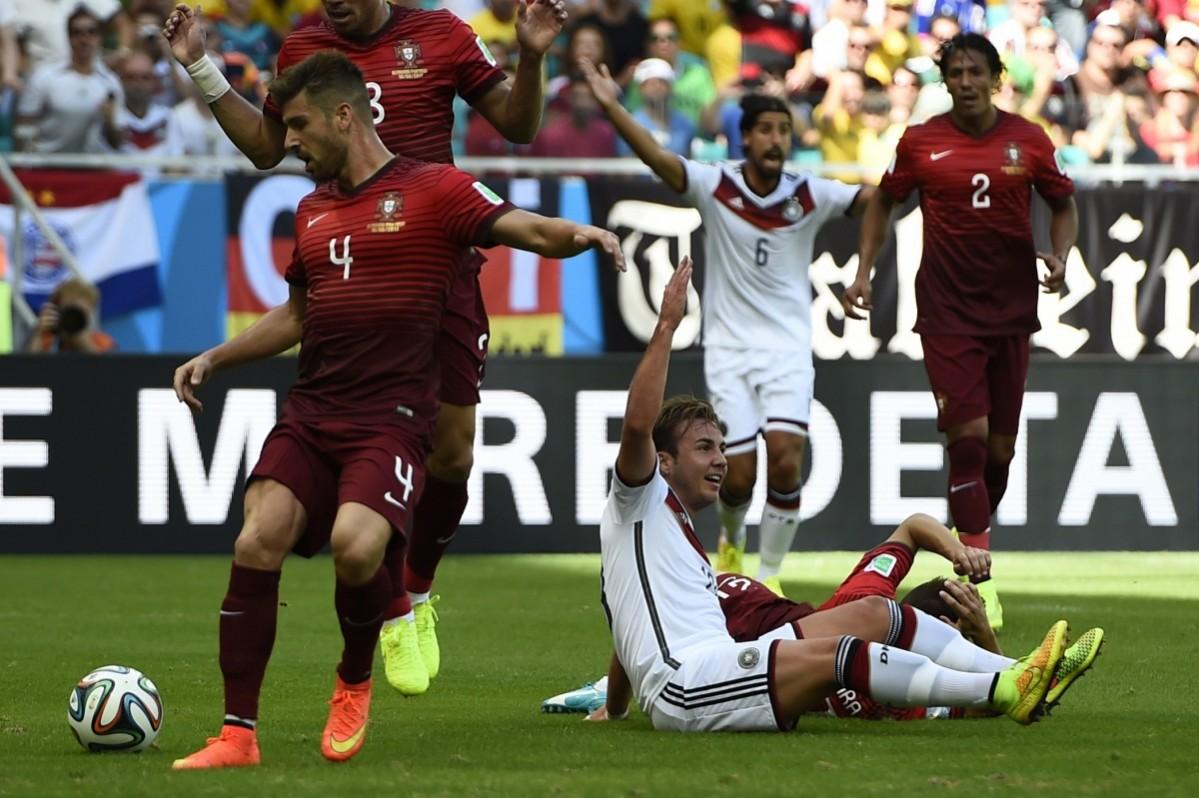 Germany's Goetze claims a penalty, after being fouled by Portugal's Joao Pereira, during their 2014 World Cup Group G soccer match at the Fonte Nova arena in Salvador Germany v Portugal