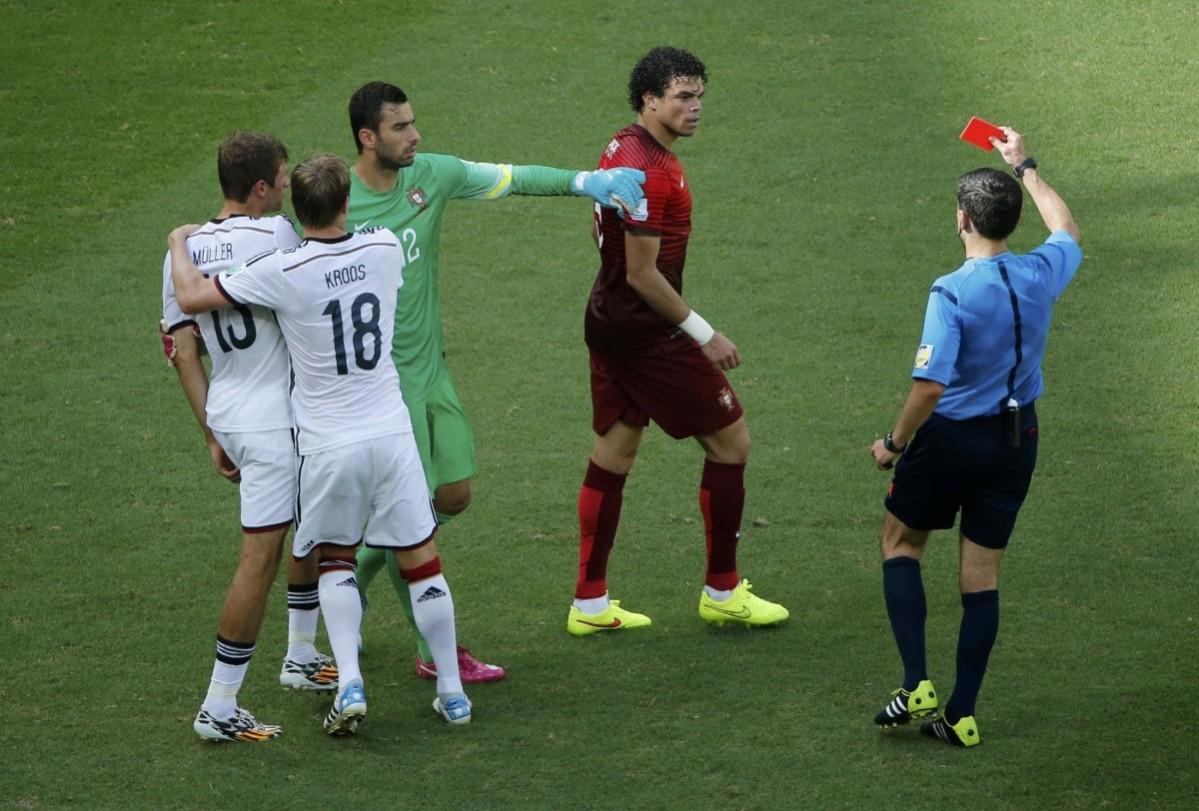 Referee shows Portugal's Pepe red card during 2014 World Cup Group G soccer match between Germany and Portugal at the Fonte Nova arena Germany v Portugal