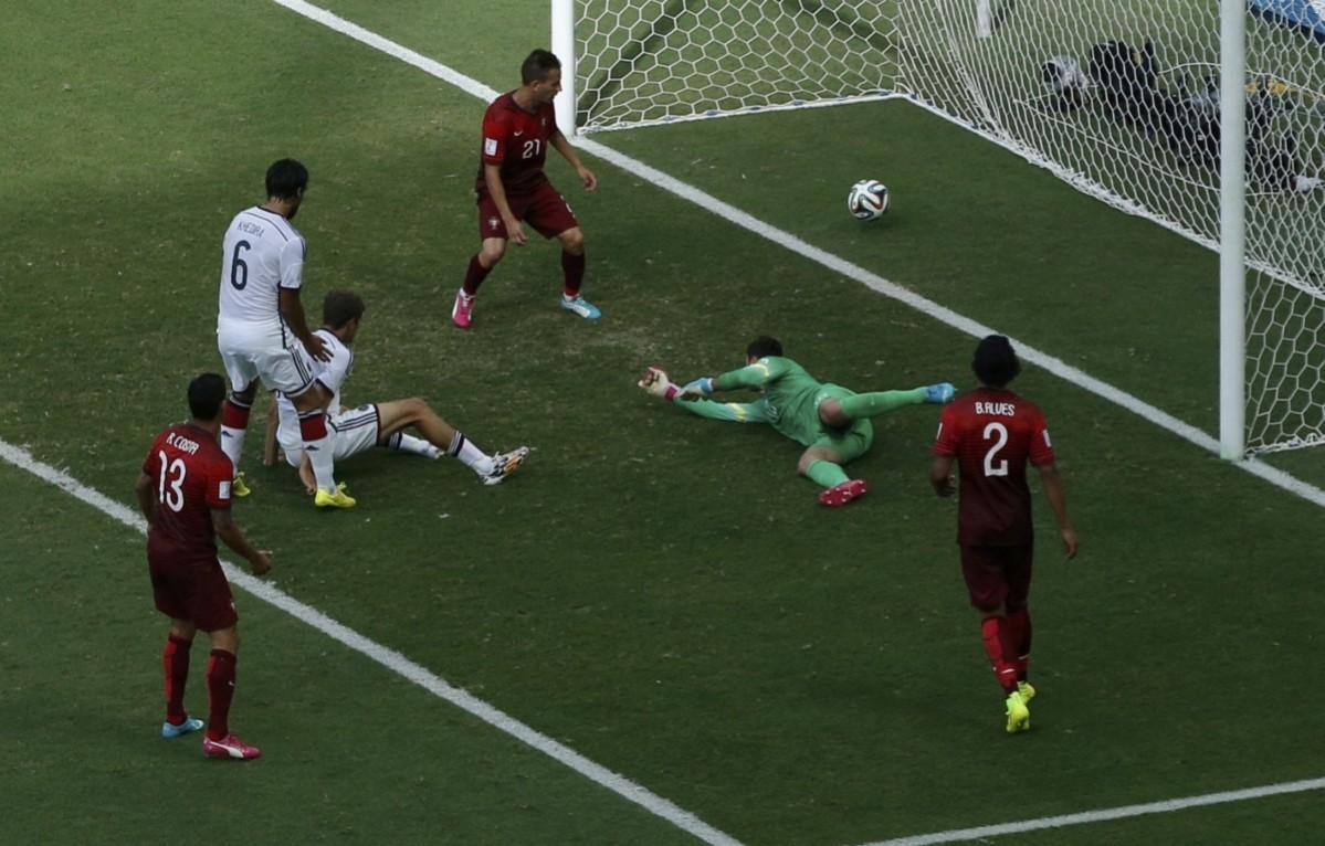 Germany's Mueller shoots to score against Portugal for his hat-trick during their 2014 World Cup Group G soccer match at the Fonte Nova arena in Salvador Germany v Portugal