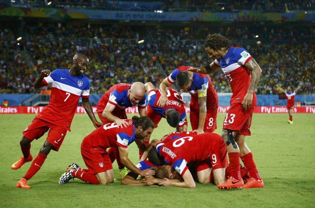 Team U.S.A celebrate during the 2014 World Cup Group G soccer match between Ghana and the U.S. at the Dunas arena Ghana vs USA