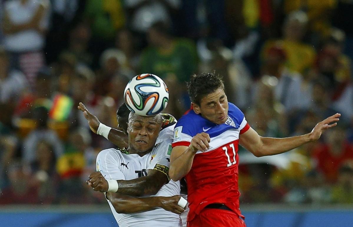 Ghana's Andre Ayew fights for the ball with Alejandro Bedoya of the U.S. during their 2014 World Cup Group G soccer match at the Dunas arena Ghana vs USA