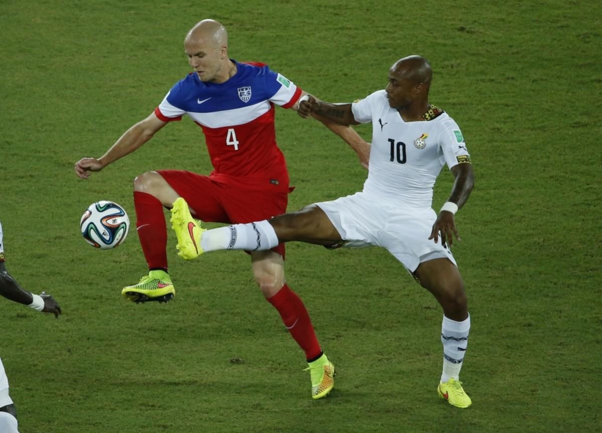Bradley of the U.S. fights for the ball with Ghana's Ayew during their 2014 World Cup Group G soccer match at the Dunas arena in Natal Ghana vs USA