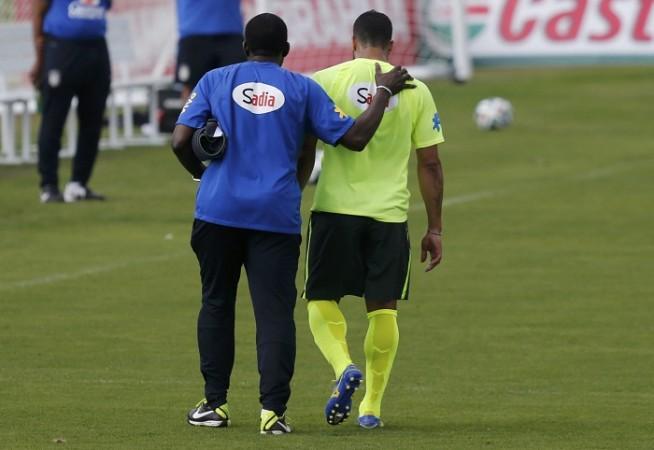 Brazil's Hulk leaves the pitch after an injury during training. Hulk Brazil